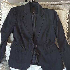 Black Blazer by The Limited. Made of polyester and rayon. Excellent condition